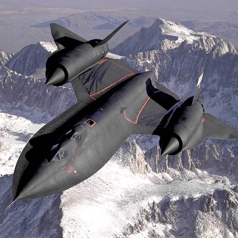 An SR-71 Blackbird flying over snow covered mountains